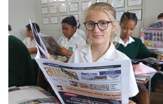 A learner reading the AWSUM News Career Guide